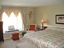 large master bedroom with bay window