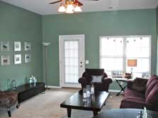 large living room with doorwall to deck